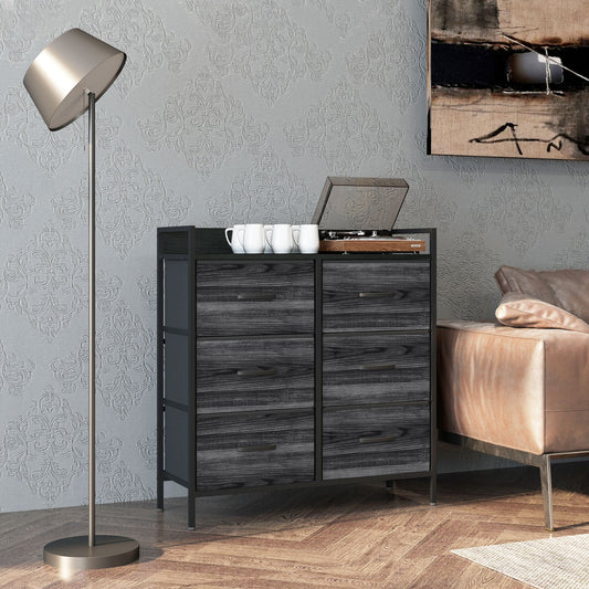 The rustic chest of drawers in a bedroom setting next to a sofa and lamp