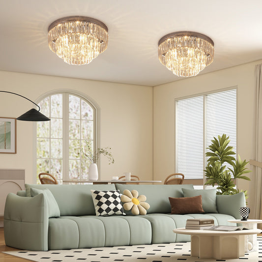Two modern crystal ceiling lights installed in a bright living room above a sofa