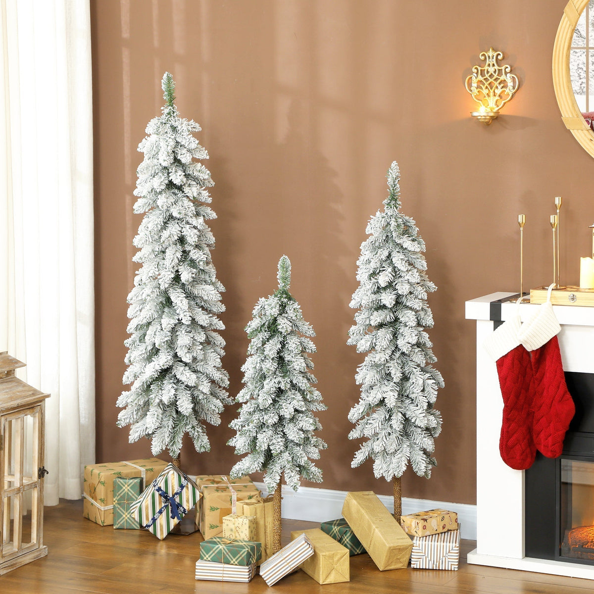 The artificial Christmas trees displayed in a living room with wrapped gifts around the base