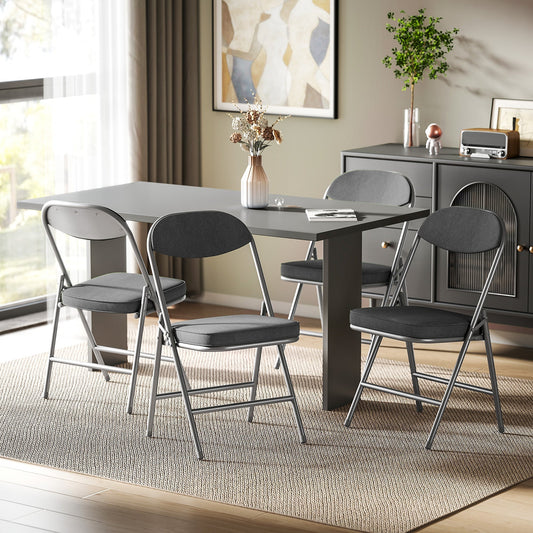 The dining chairs placed around a dark grey table in a modern living room setting