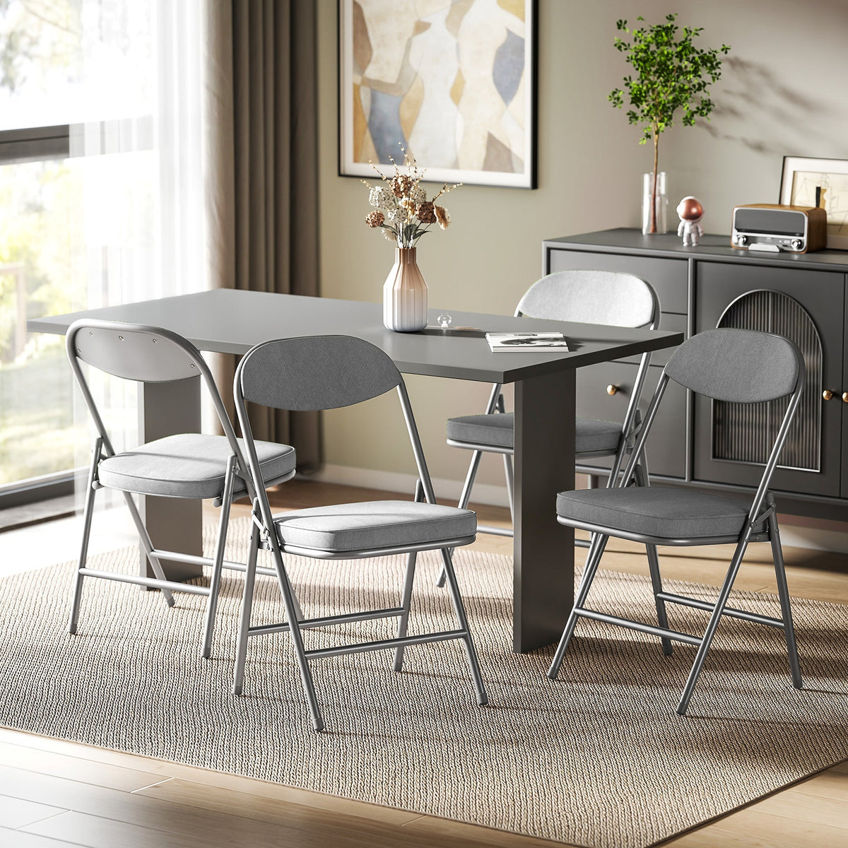 The folding chairs placed around a dining table in a modern living room setting