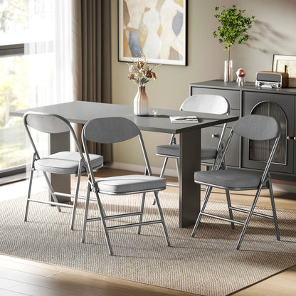 The folding chairs placed around a dining table in a modern living room setting