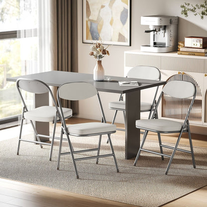 Four folding chairs around a dining table in a room setting