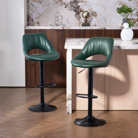 Two dark green faux leather bar stools in a modern kitchen setting