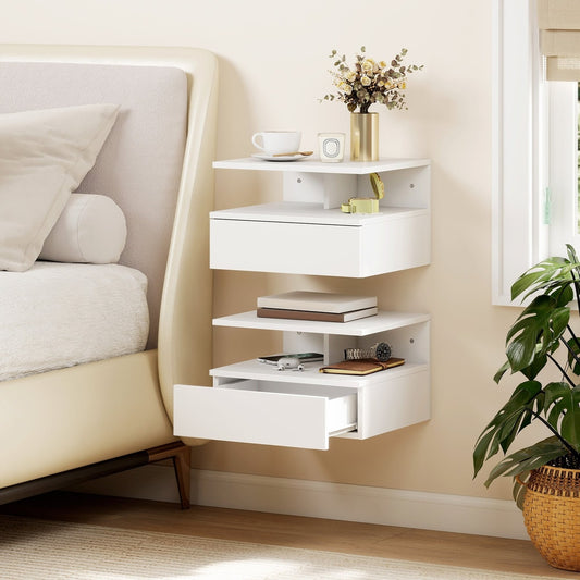 Two white floating bedside tables mounted on a wall next to a bed, one drawer open