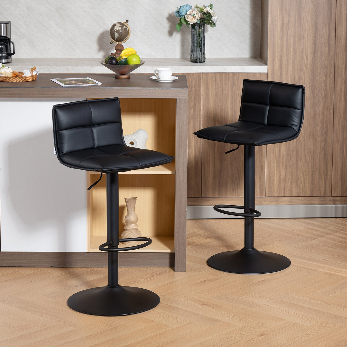 The bar stools positioned in a modern kitchen setting next to a breakfast counter
