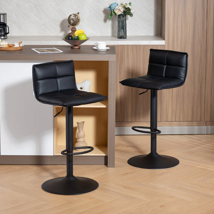 The bar stools positioned in a modern kitchen setting next to a breakfast counter