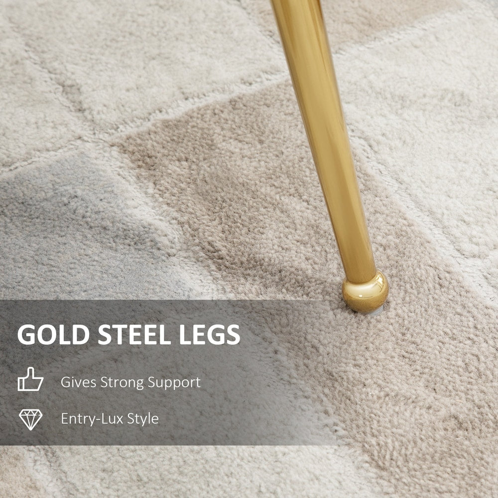 Close-up of the gold steel legs on the pink velvet dining chair