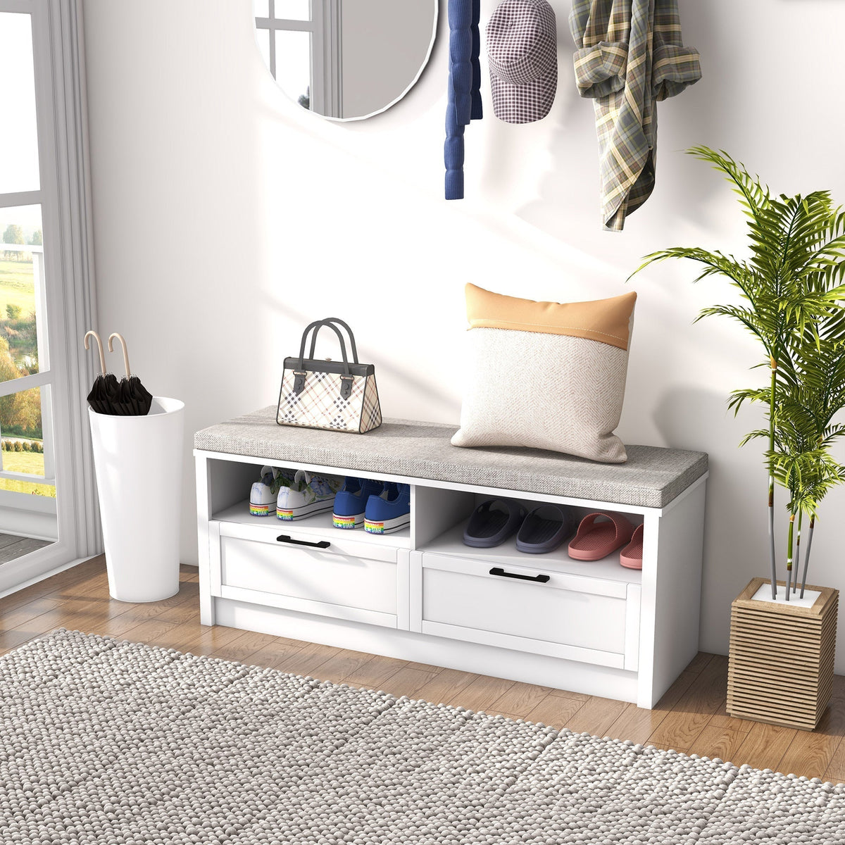 The shoe storage bench placed in a bright hallway with shoes stored in the open compartments