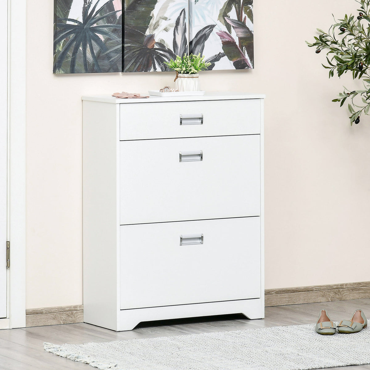 The white shoe storage cabinet in a hallway with shoes on the floor