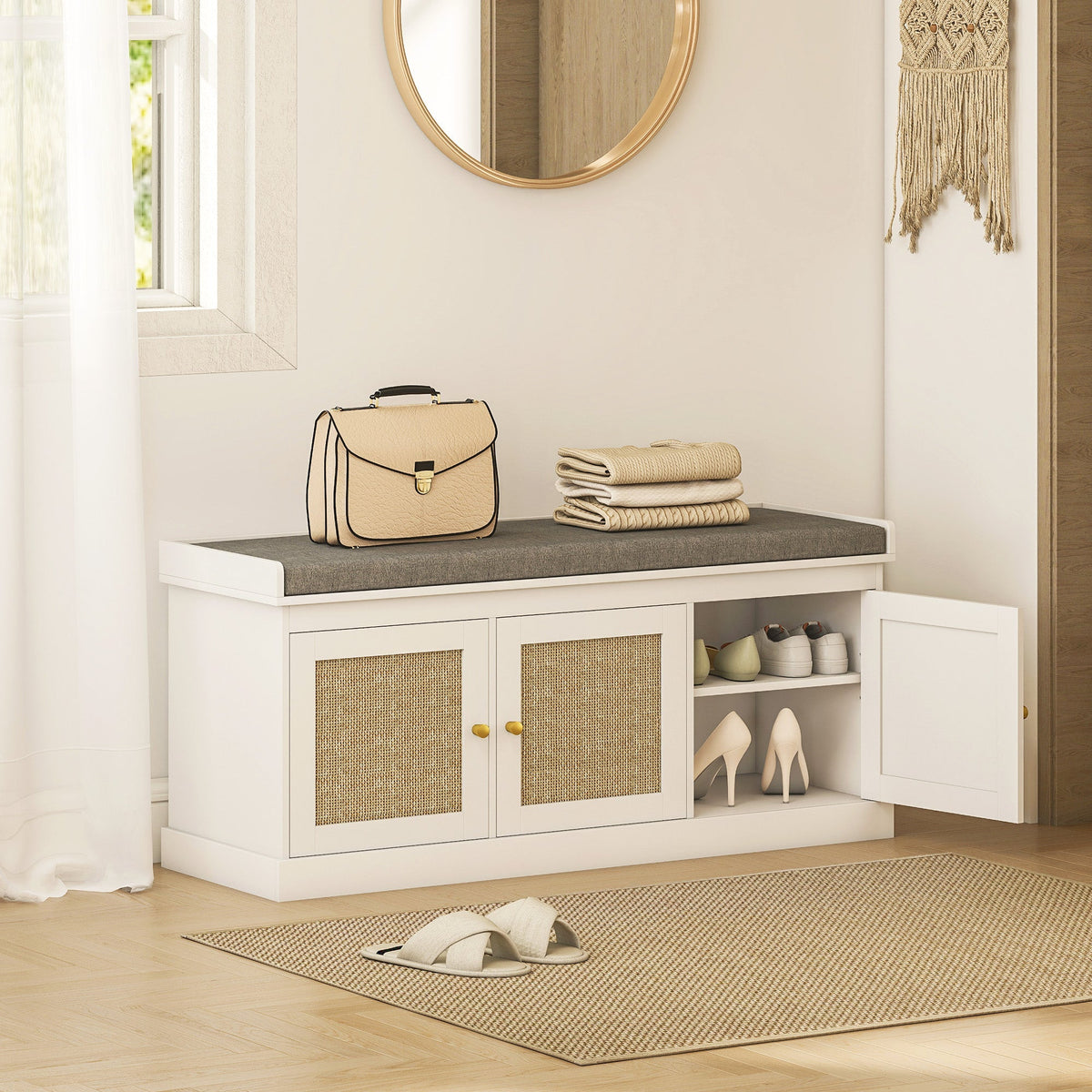 The shoe storage bench placed in a hallway with shoes and a bag on the grey padded seat