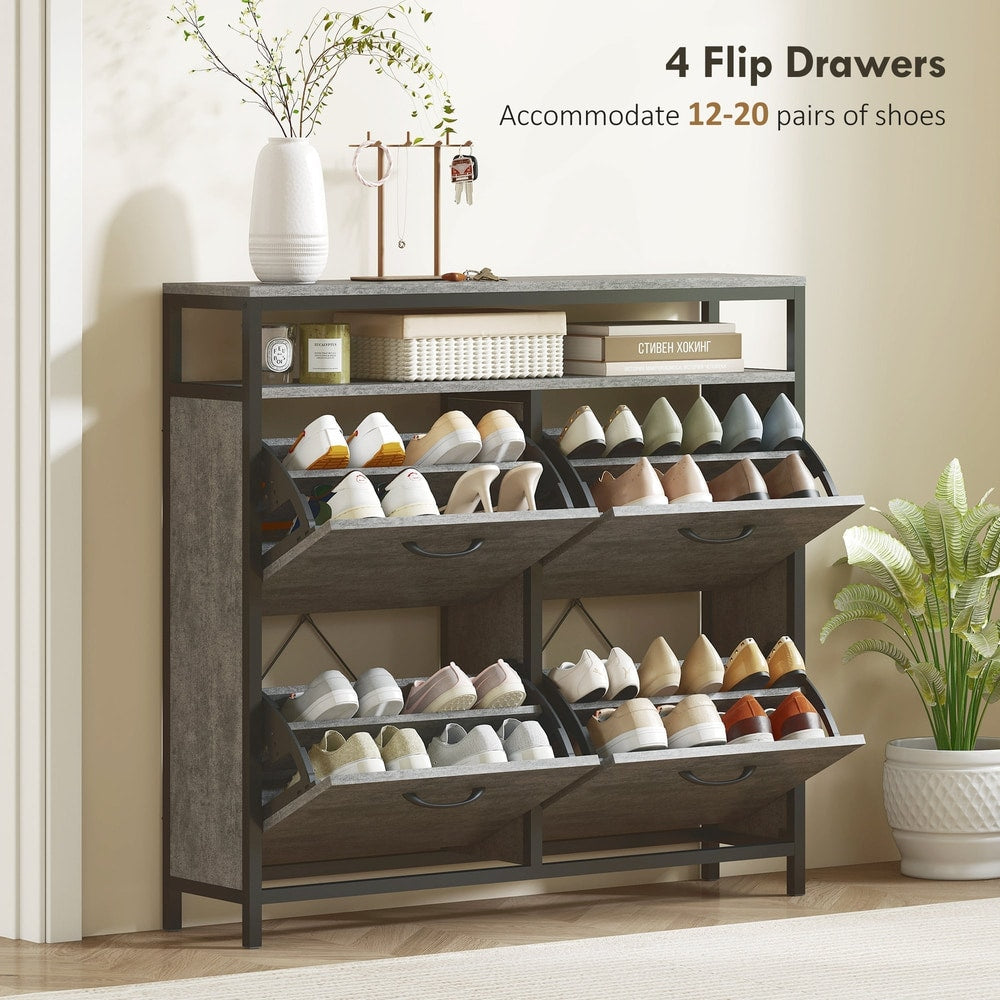 The shoe storage cabinet with all four flip drawers open showing shoes inside