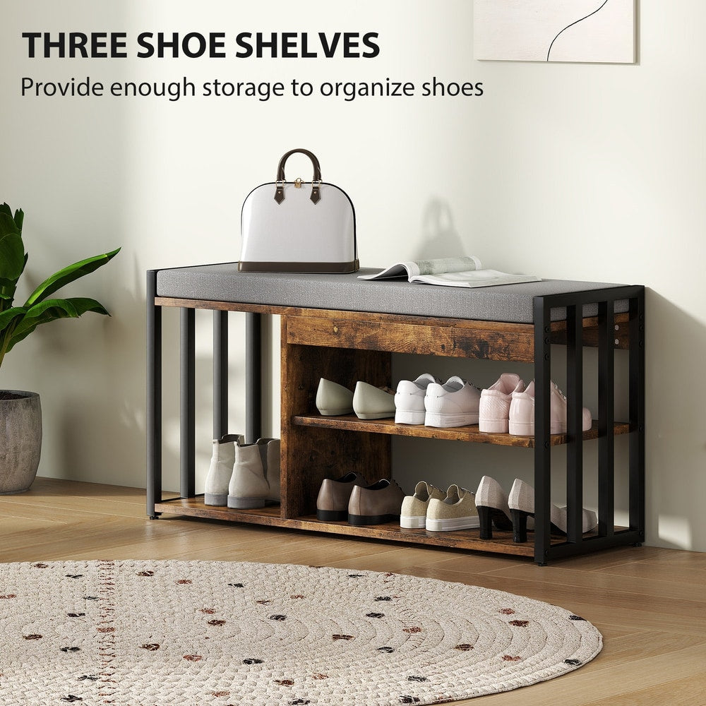 The shoe storage bench with seat, showing three shelves filled with shoes and a handbag on top