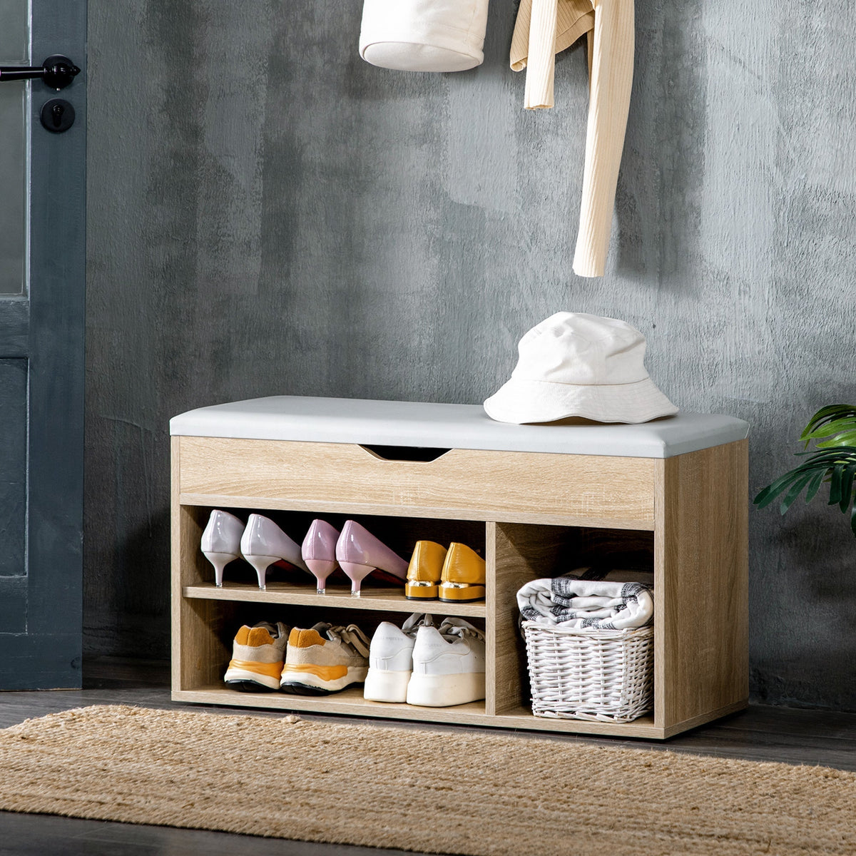 The shoe storage bench in use in a hallway with shoes and a basket inside