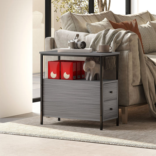 The side table placed next to a sofa in a living room with decorative items on the shelves