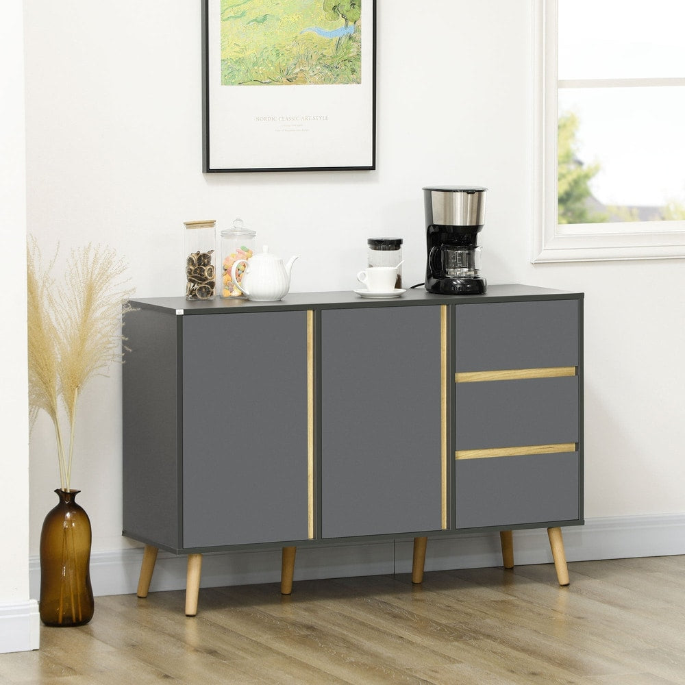 This modern kitchen cupboard is shown in a dining room setting with a coffee maker on top