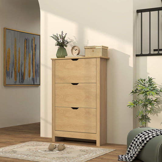 Narrow shoe cupboard with three drawers in a hallway setting with shoes on the floor