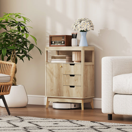 The small storage cabinet with a fluted door and three drawers, shown in a room setting