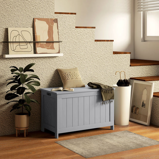 A grey wooden toy box used for storage in a modern living room setting