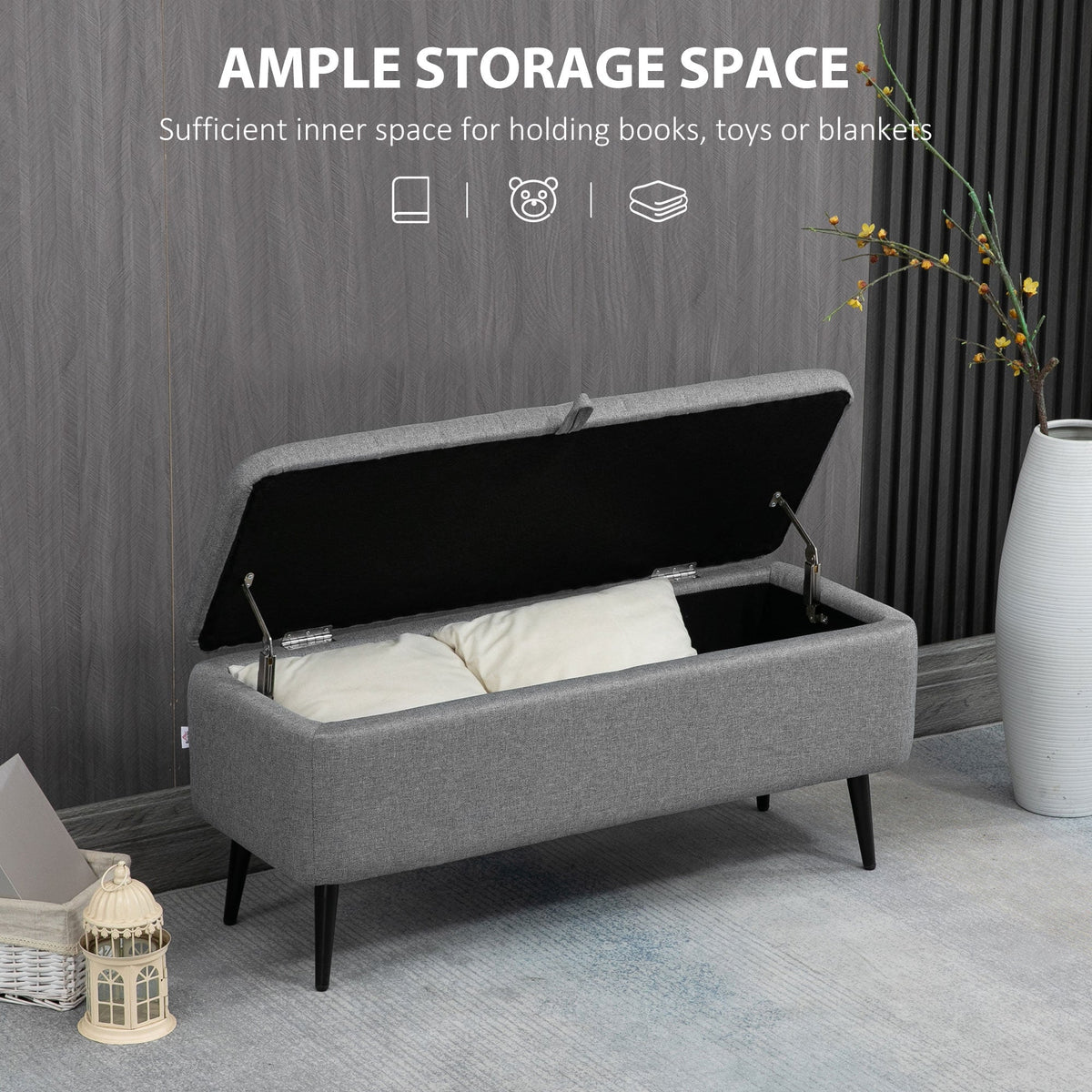 The open storage bench revealing ample space inside, with pillows placed within