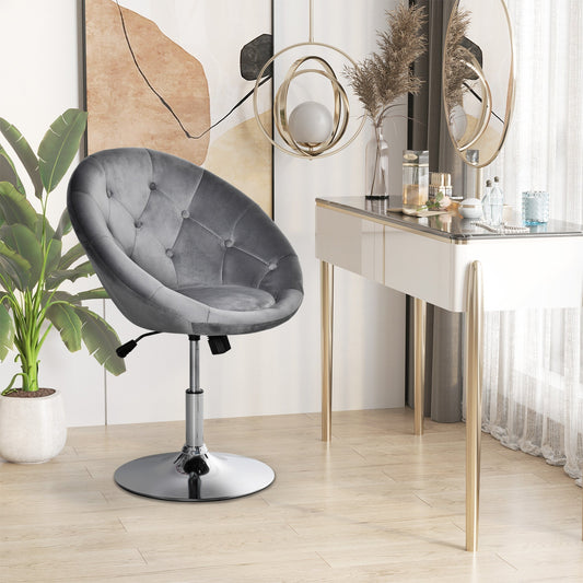 Grey velvet-feel dressing stool in a bedroom next to a vanity table