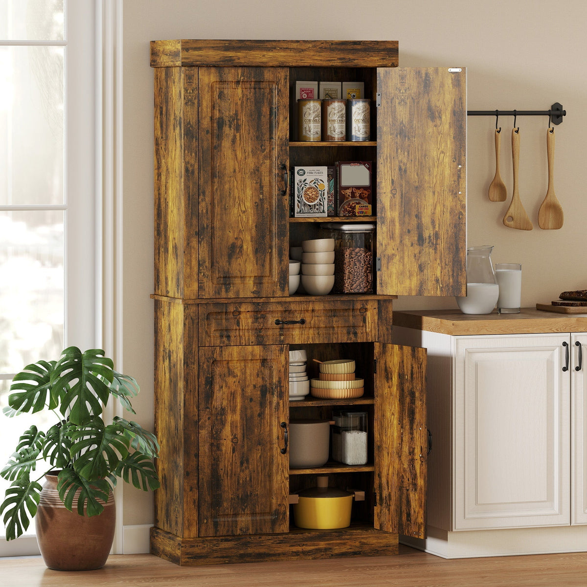 The tall kitchen cupboard with its doors open, showing shelves stocked with food items and kitchenware