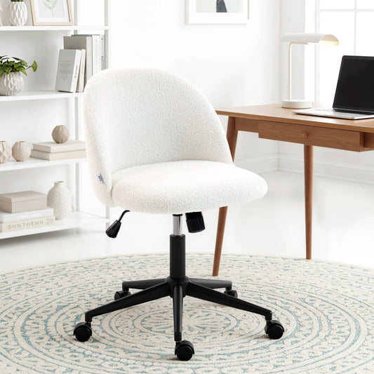 The cream white teddy fleece office chair with wheels is shown in a home office setting