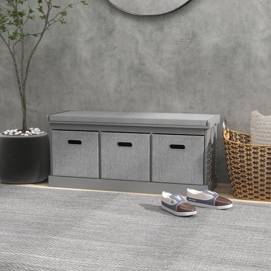 The shoe storage bench with padded top seat is shown in a hallway setting with shoes and a basket nearby