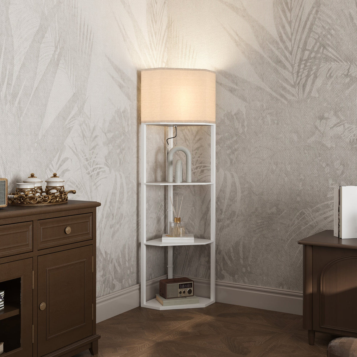 The white corner floor lamp with shelves is lit up in a room with patterned wallpaper