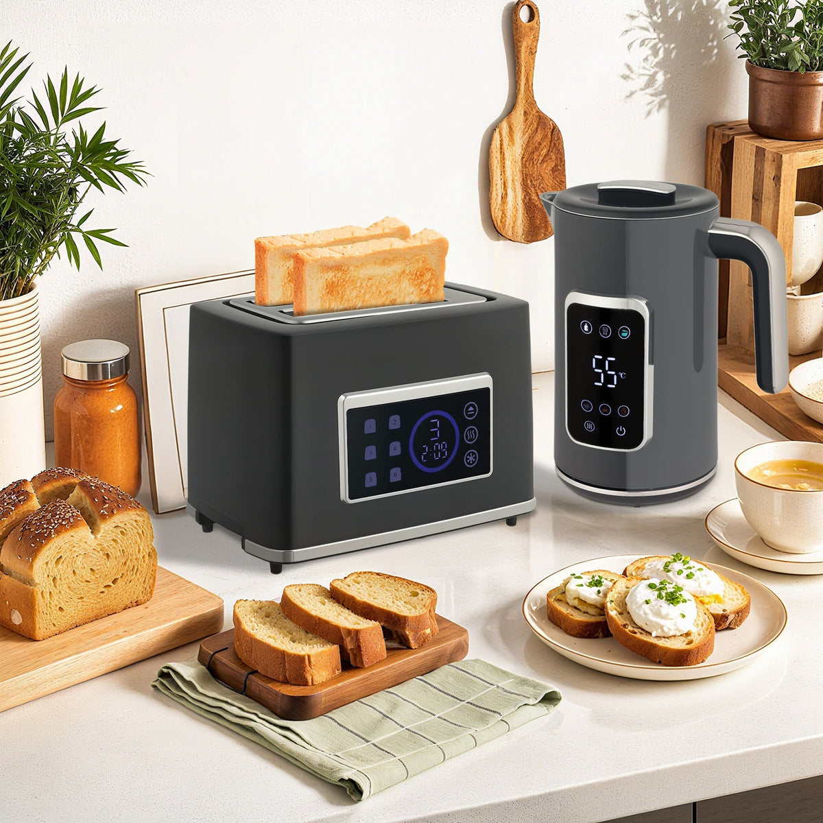 The grey kettle and toaster set in use on a kitchen counter with toast and coffee
