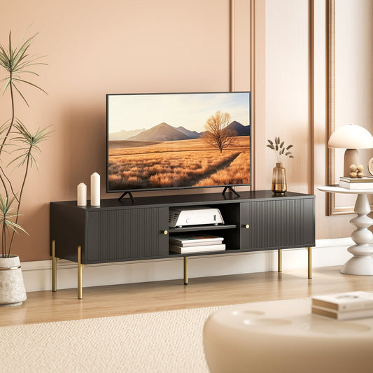 The black entertainment unit supporting a television in a modern living room setting
