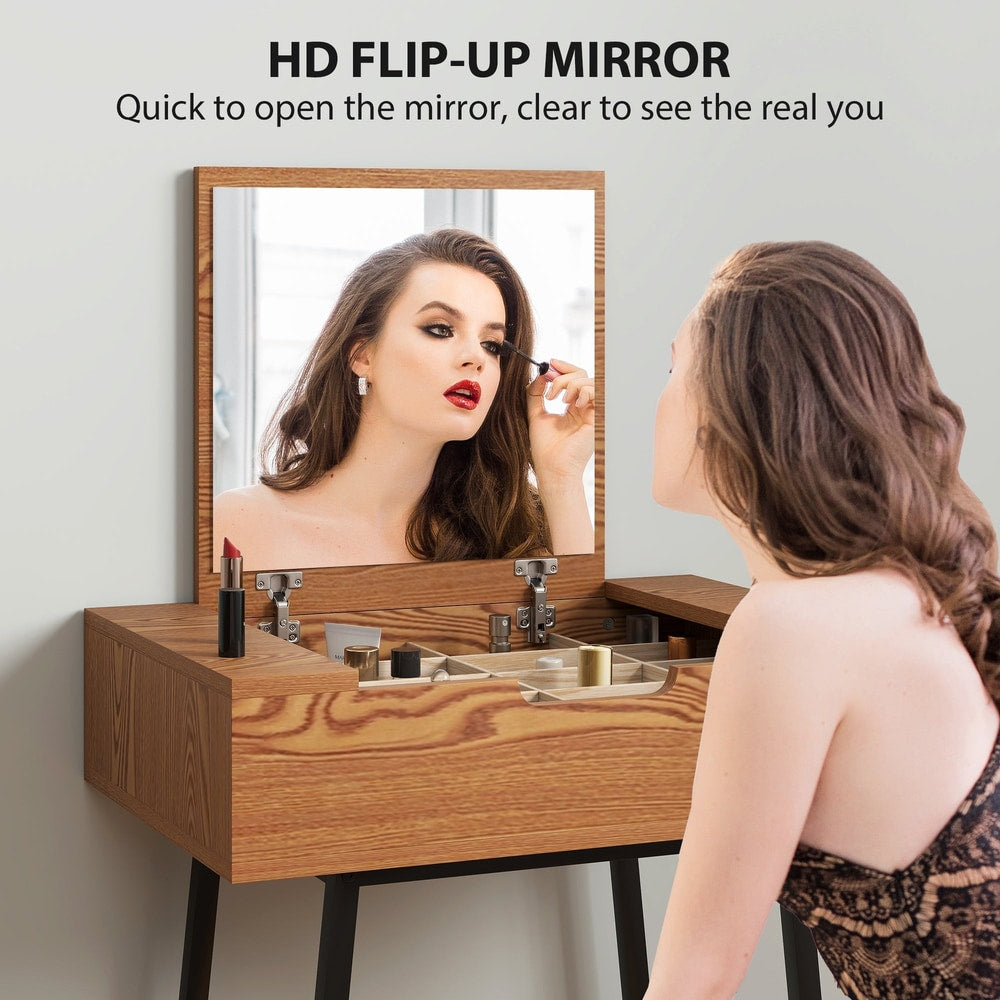 A woman applying makeup while looking into the open mirror of the dressing table