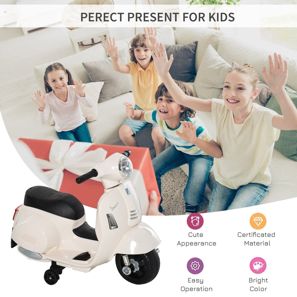 Children reacting excitedly to a gift box next to the white kids electric motorbike