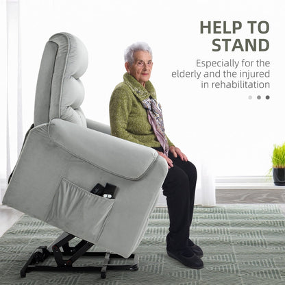 Elderly woman using the grey electric power lift recliner chair to help her stand