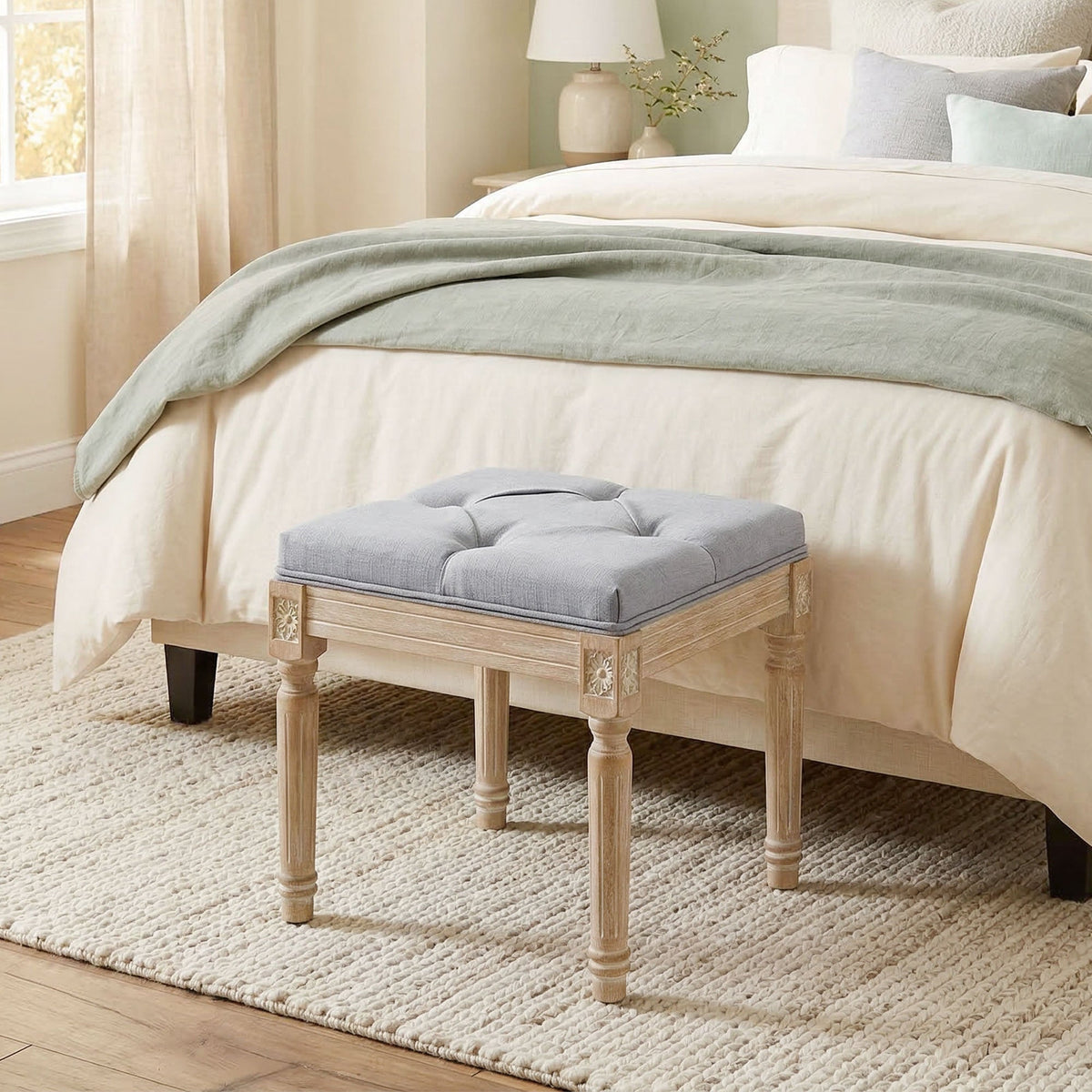HOMCOM Vintage Foot Stool, the light grey footstool sits at the end of a bed on a rug in a bedroom setting