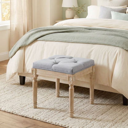 HOMCOM Vintage Foot Stool, the light grey footstool sits at the end of a bed on a rug in a bedroom setting