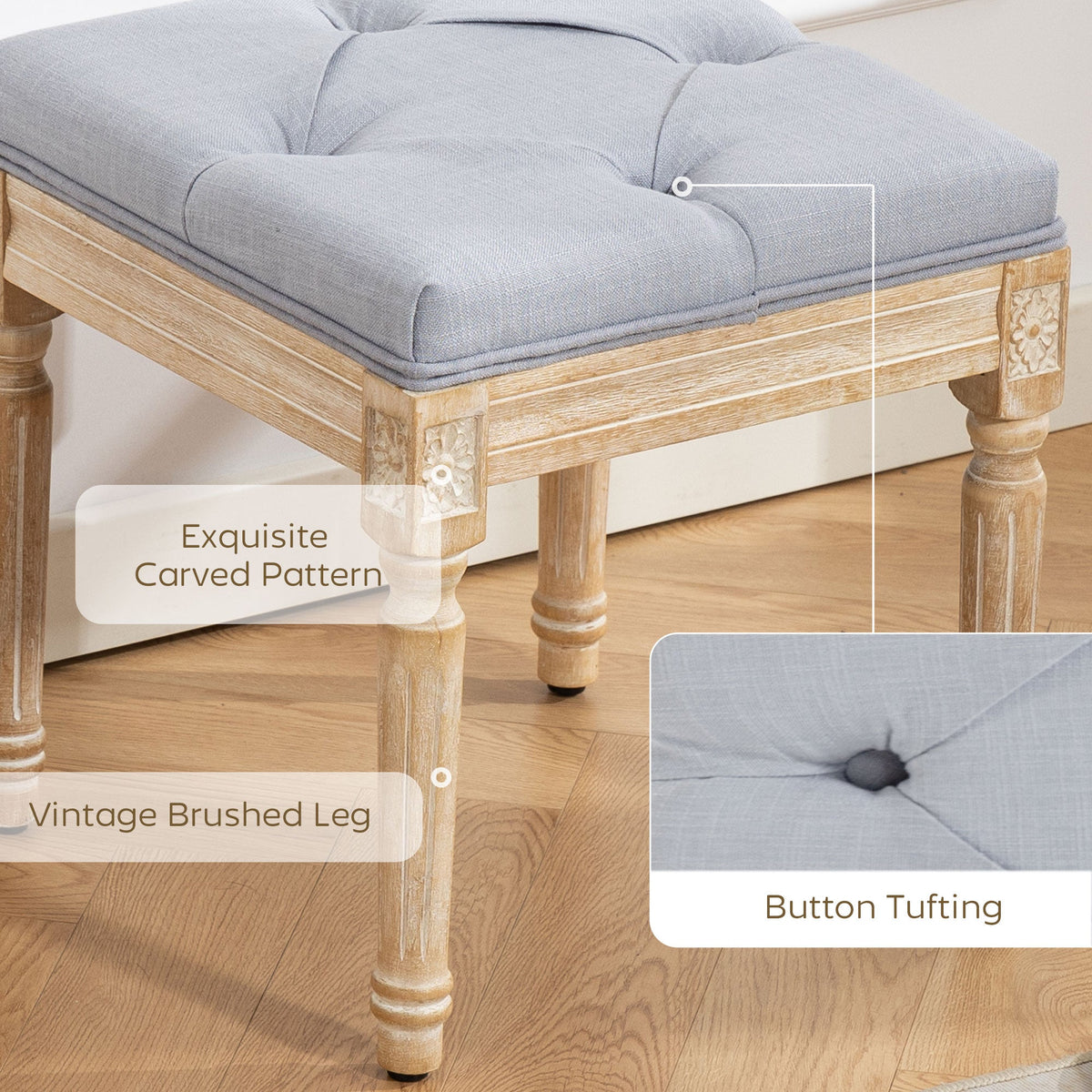 Close up of the vintage foot stool showing the carved pattern on the wooden legs and the button tufting on the seat