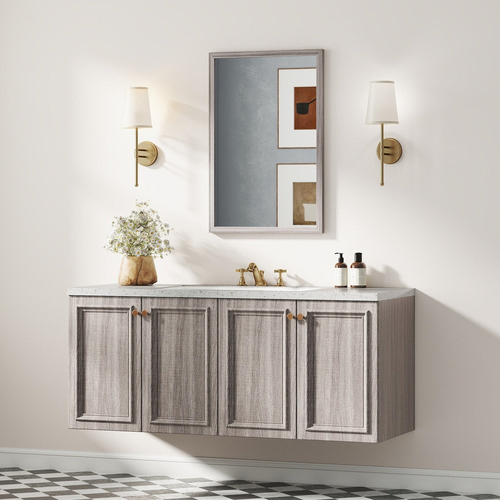 The wall mirror is shown above a grey vanity unit in a bathroom setting