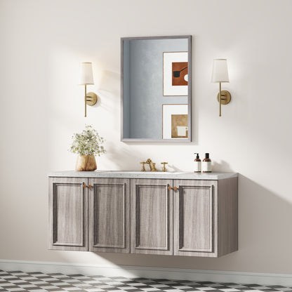 The wall mirror is mounted above a grey vanity unit in a bathroom setting