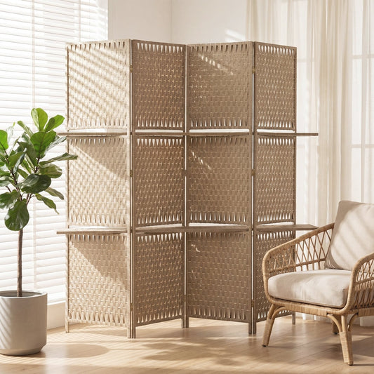 The room divider set up in a bright living room with a plant and armchair