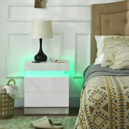The white bedside table with LED light is shown in a bedroom setting next to a bed