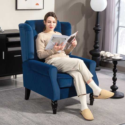 Woman reading a magazine while sitting on the blue velvet accent chair in a living room