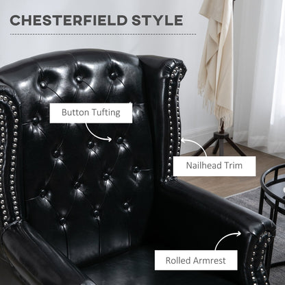 Detail of the black wingback accent chair showing button tufting, nailhead trim and rolled armrest