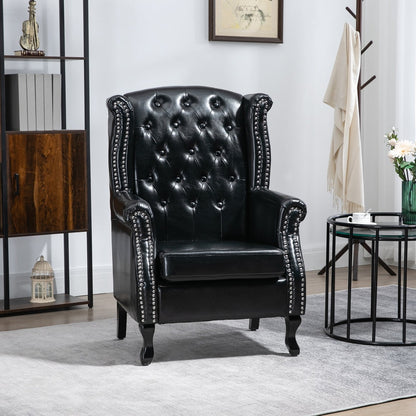 The black wingback accent chair in a stylish living room setting next to a shelf and coffee table