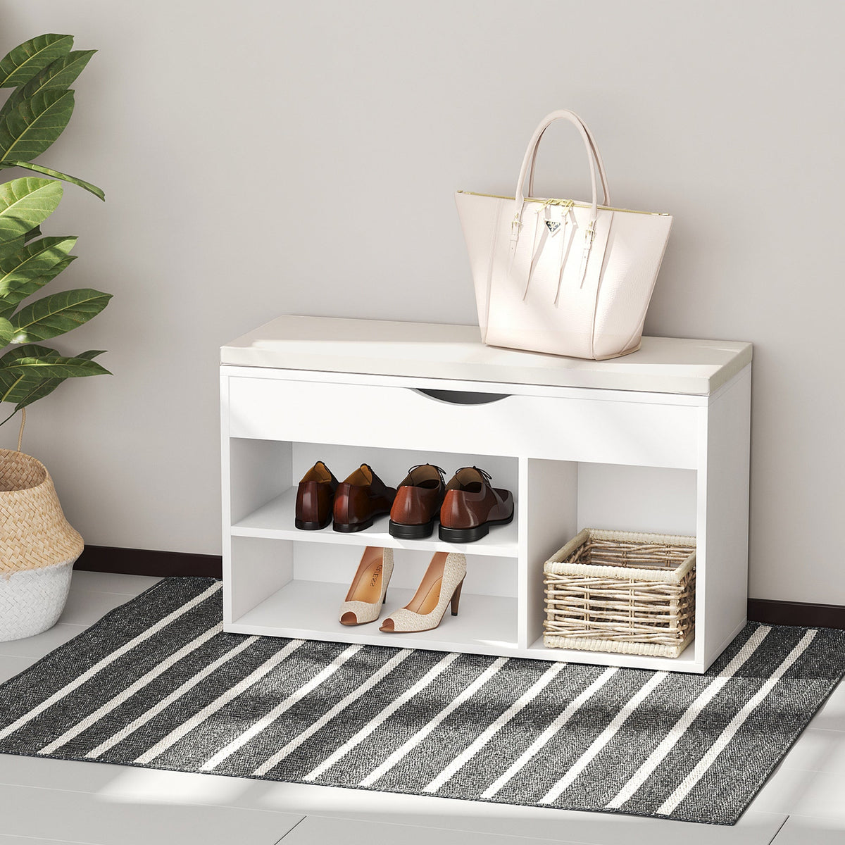 The shoe storage unit placed in a hallway with shoes, a basket and a handbag on top