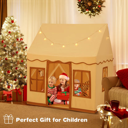 Children sitting inside the play tent with star lights, a festive Christmas tree nearby