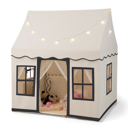 Indoor Kids Play Tent in beige with star lights and soft toys inside on a white background