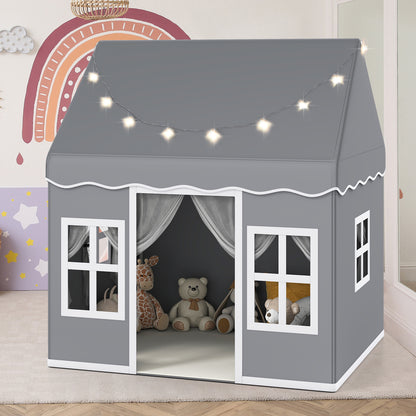 Grey children's play tent with star lights, set up in a child's bedroom with toys inside