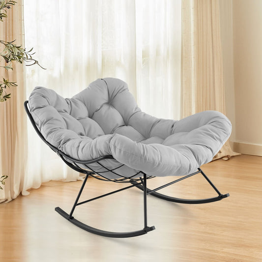 The accent chair positioned in a bright living room with wooden flooring