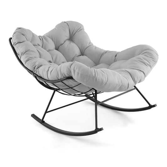 Indoor Outdoor Rocking Chair with a light grey tufted cushion and black metal frame